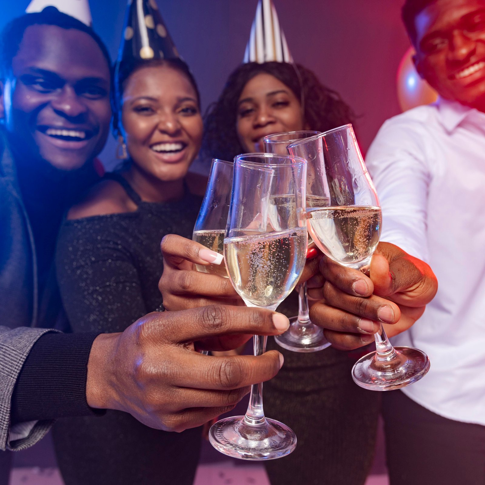 friends-wearing-party-hats-toasting-with-champagne(1)